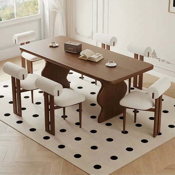 Dark Wood Dining Table - Lavish & Finesse with stylish chairs and a striking rug.