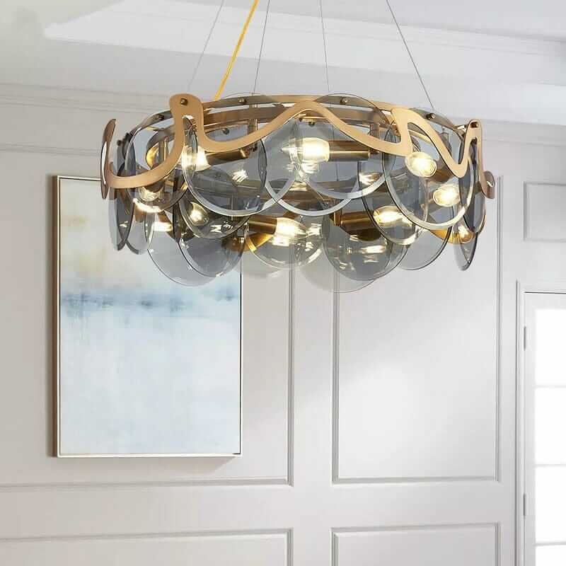 Elegant glass lustre gold iron pendant chandelier with contemporary design in a modern interior setting.