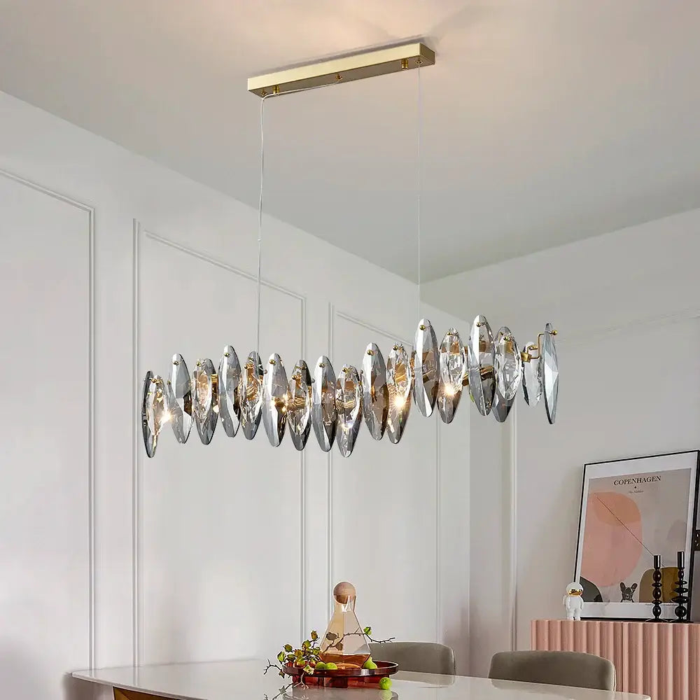 Long Restaurant Crystal Chandelier with geometric design illuminating a stylish dining space.