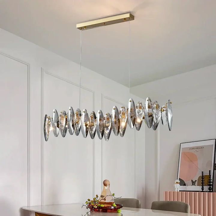 Long Restaurant Crystal Chandelier with geometric design illuminating a stylish dining space.