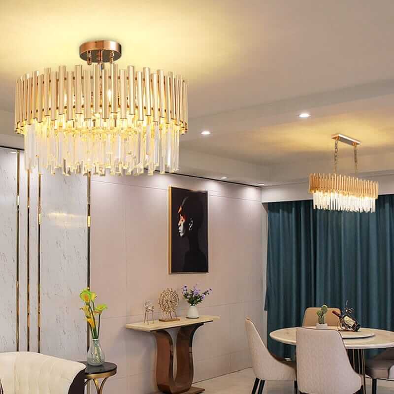 Stylish gold chandelier with crystal accents illuminating a modern dining area, adding elegance to the space.