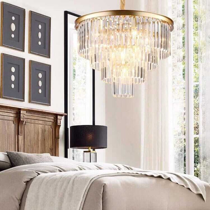 Luxurious Gemima Round Golden Crystal Chandelier illuminating a stylish bedroom with elegant decor.