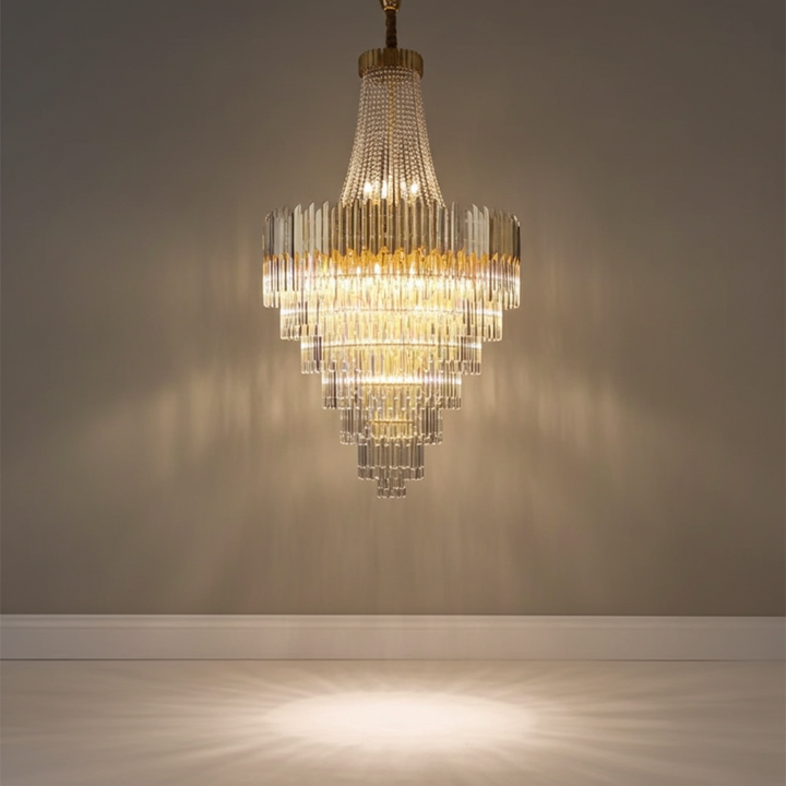 Chandelier hanging in a room with a neutral wall and floor.