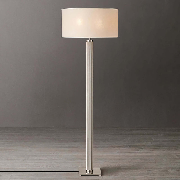 Gold Floor Lamp - Contemporary & Chic standing tall with a sleek brass design and elegant white shade for sophisticated decor.