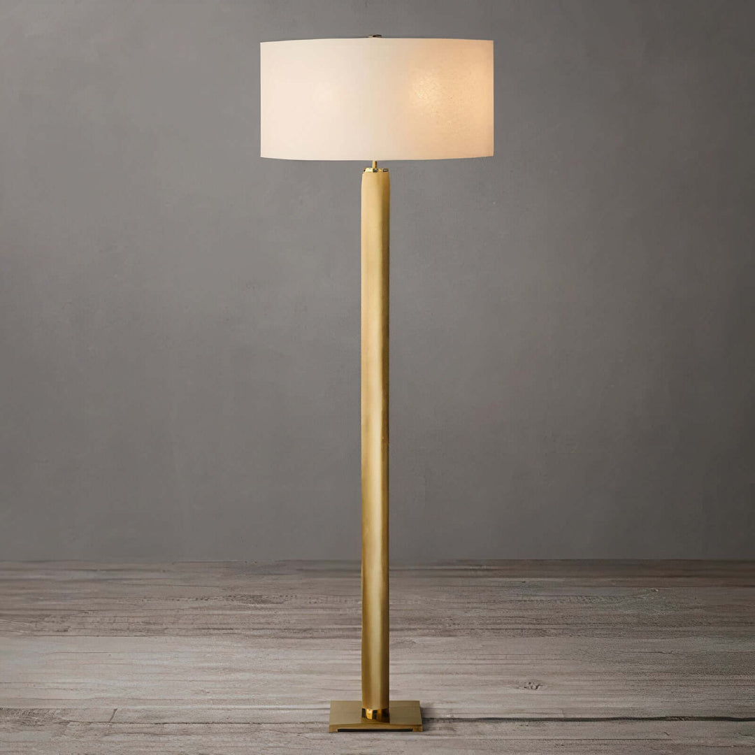 Gold Floor Lamp - Contemporary & Chic with a sleek brass design and a white shade, adding elegance to any room.