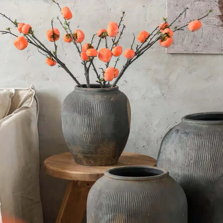 Ceramic Large Planter Pots - Large Indoor Plant Pots with decorative branches in a rustic setting.