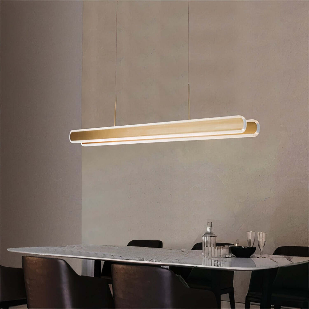 Linear Chandelier - Gold Chandelier hanging above a dining table, showcasing its elegant and modern design.