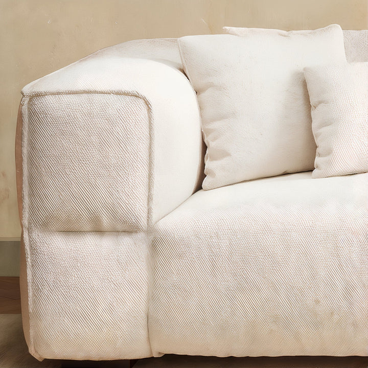 Living Room Sofa Set - Fabric Sofa corner detail featuring luxurious ivory bouclé upholstery and soft cushions.