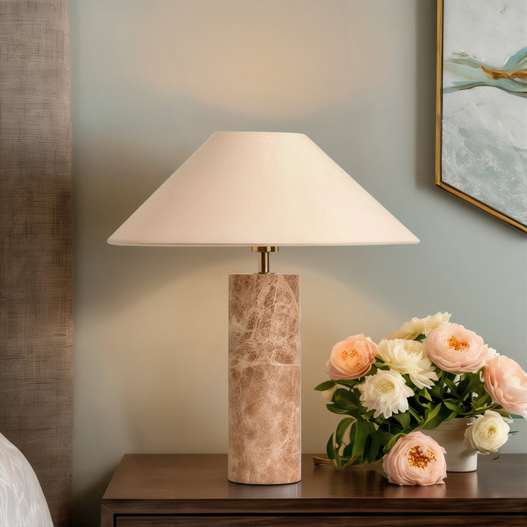 Mid Century Table Lamp - Perfect Minimalistic Design with travertine base and shade, placed on a bedside table with flowers.