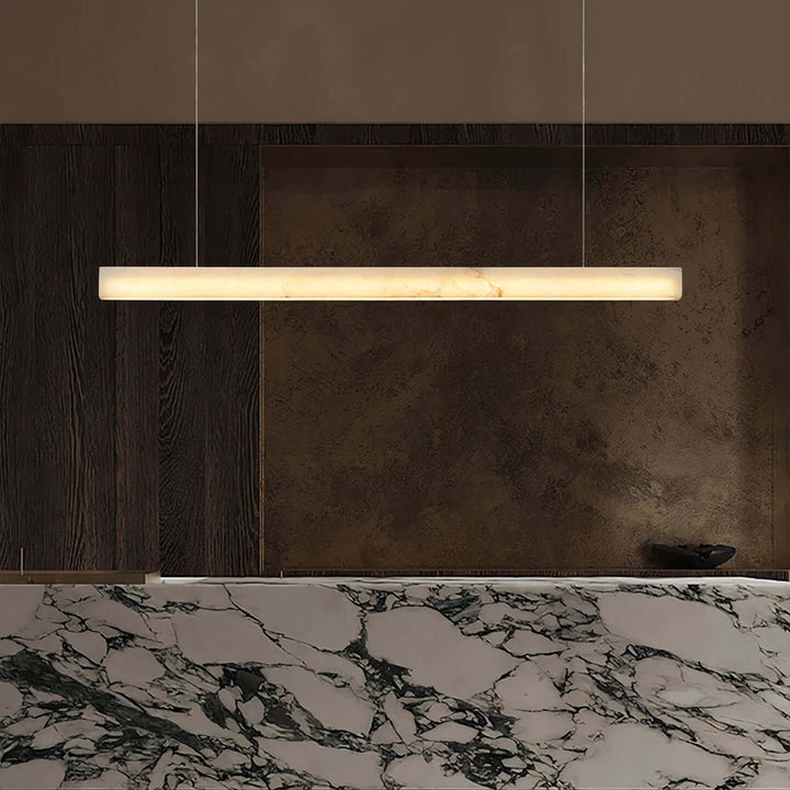 Modern LED Ceiling Light - A Contemporary Touch hanging above a marble countertop in a stylish interior.