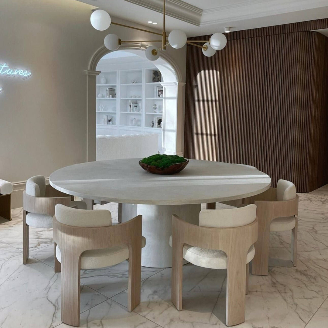 Comfortable Reading Armchair - Modern & Luxurious in a stylish dining setting with a round table and elegant chairs.