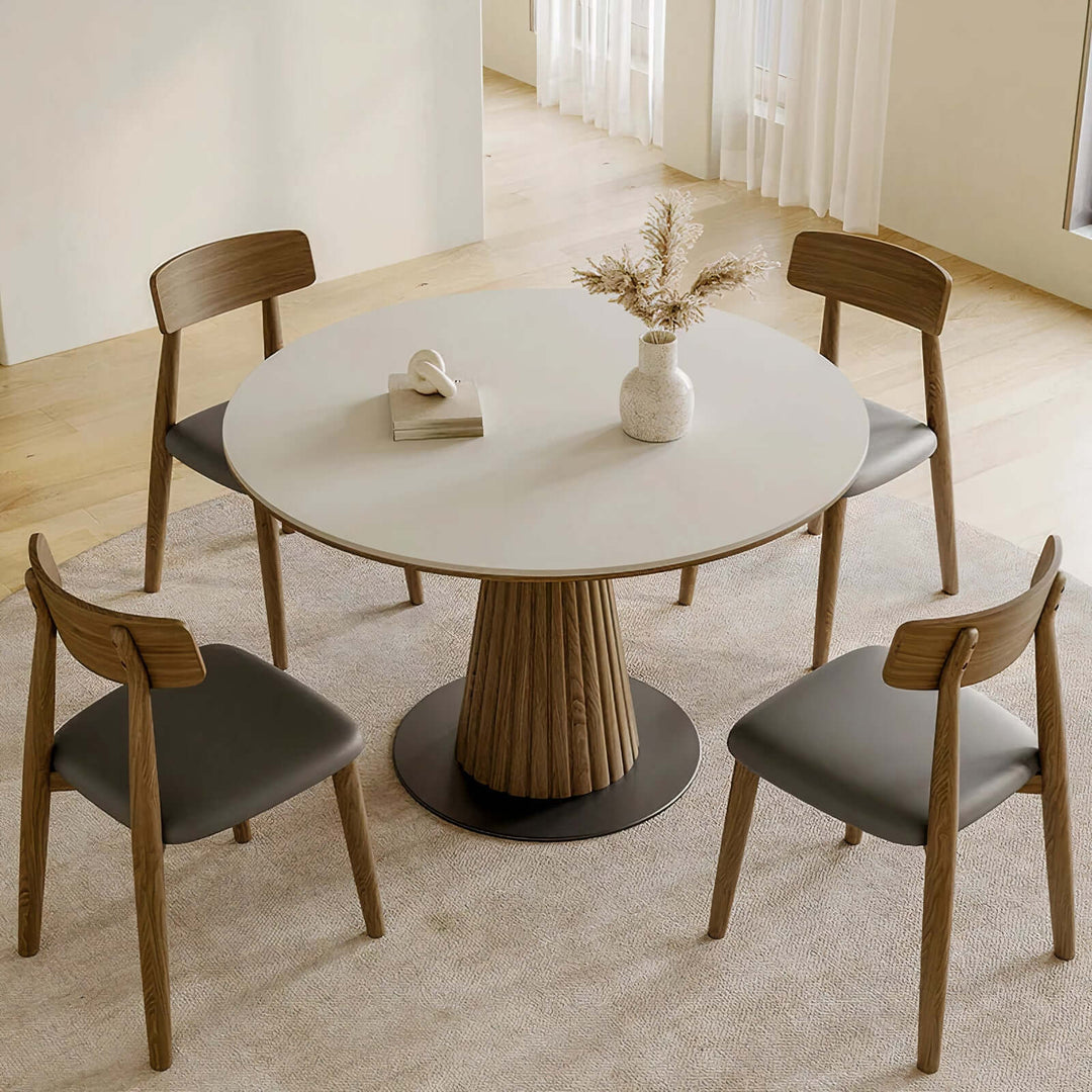 Dining And Table - Wood Dining Table featuring a round table with a wooden base and stylish chairs.