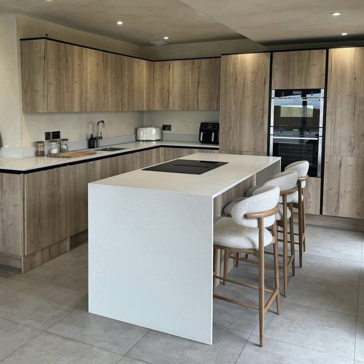 Modern Bar Stools - Wooden Bar Stools in a stylish kitchen with light wood cabinetry and a sleek white island.