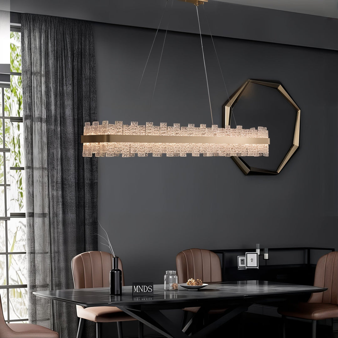 Gold Chandelier - Linear Chandelier illuminating a modern dining space with sophistication and elegance.
