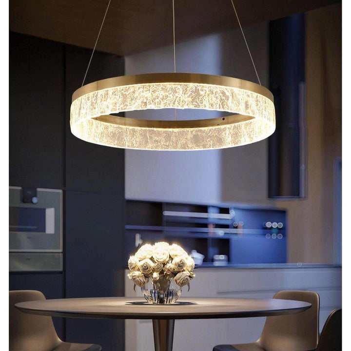 Staircase Chandelier - Foyer Chandelier illuminating a modern dining space with elegant gold finish and LED light.