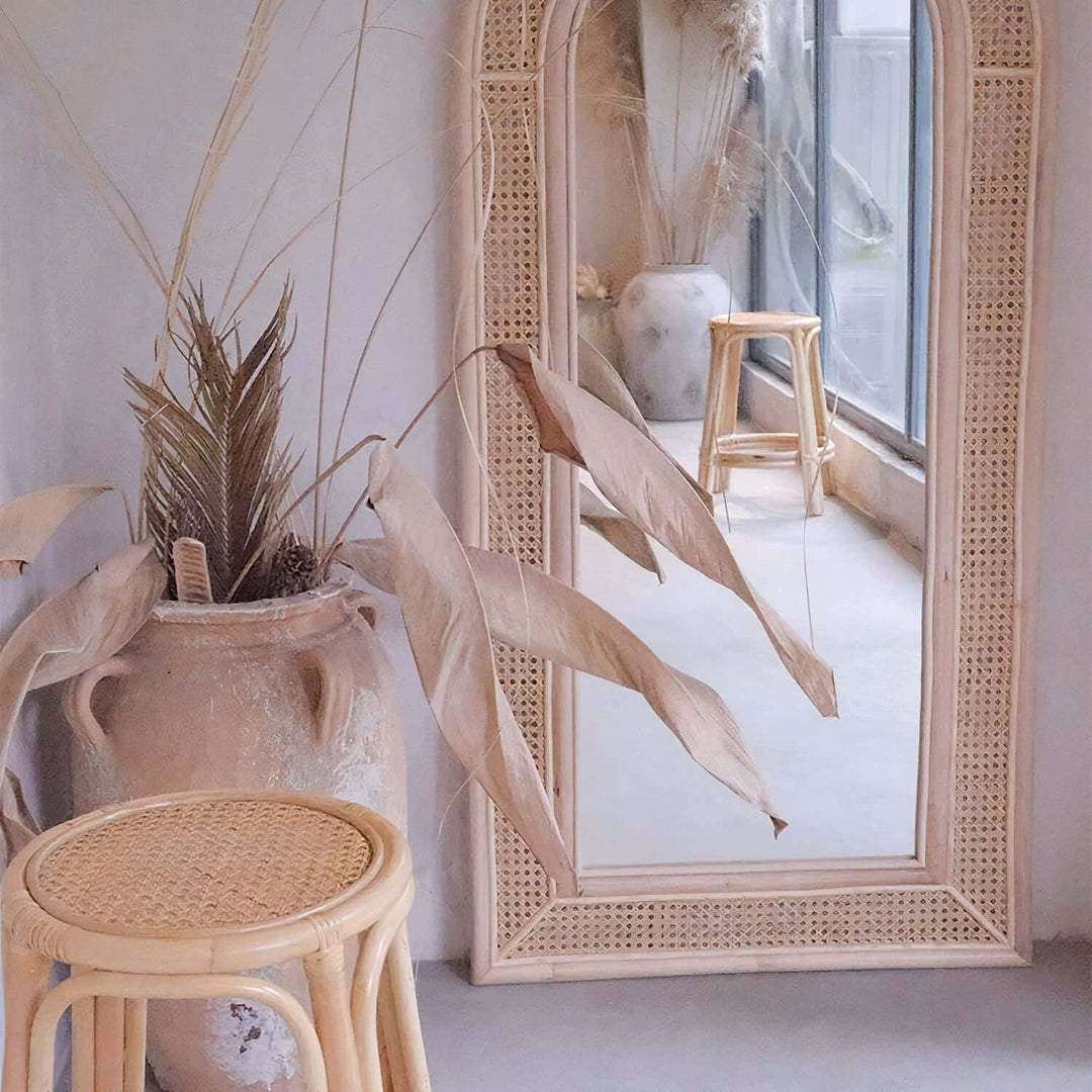 Arched Mirror - Full Length Mirror in a stylish room with decorative plants and a rattan stool, showcasing elegant design.