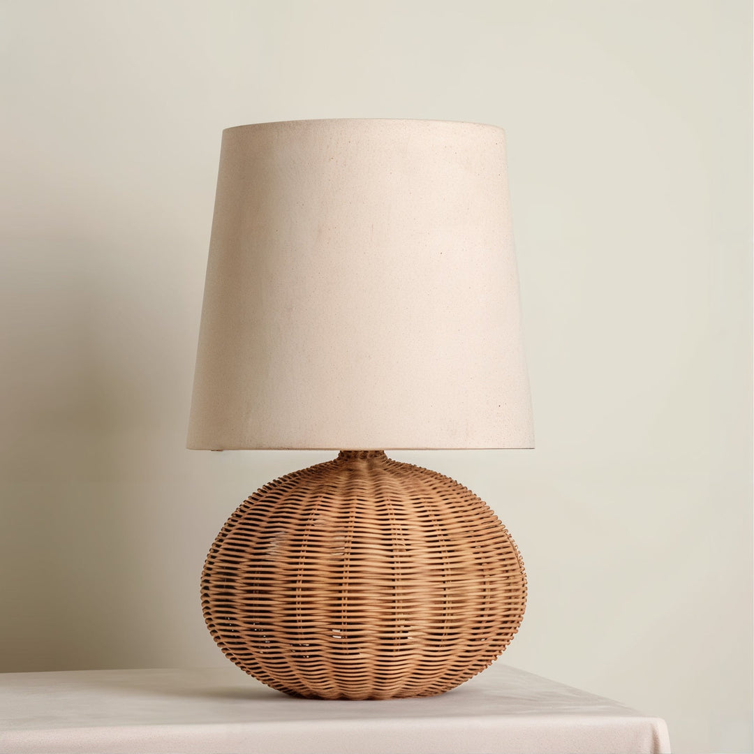 Mid Century Table Lamp - Traditional Yet Contemporary with woven rattan shade illuminating a cozy space.