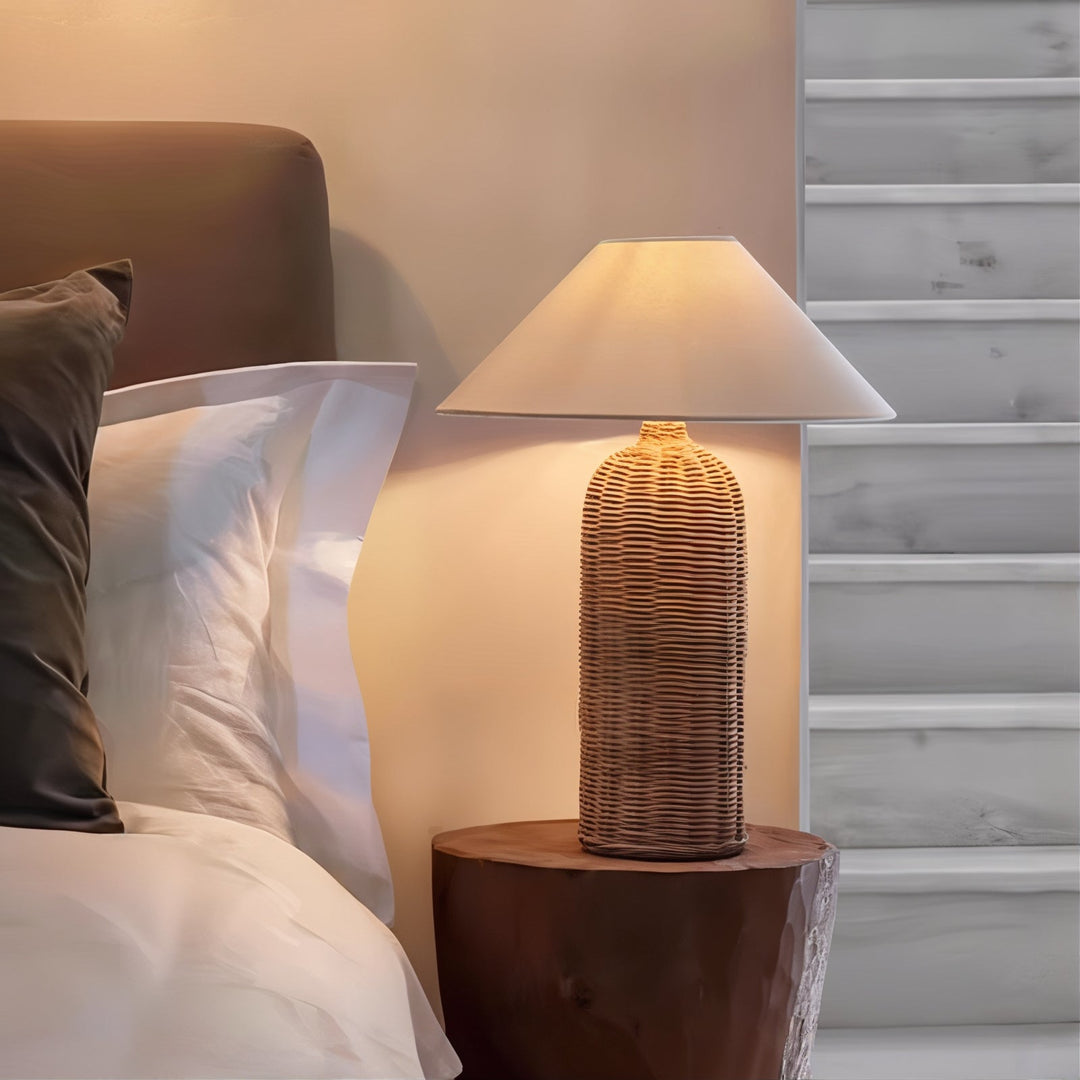 Mid Century Table Lamp - Traditional Yet Contemporary illuminating a bedside table in a cozy, elegant bedroom setting.