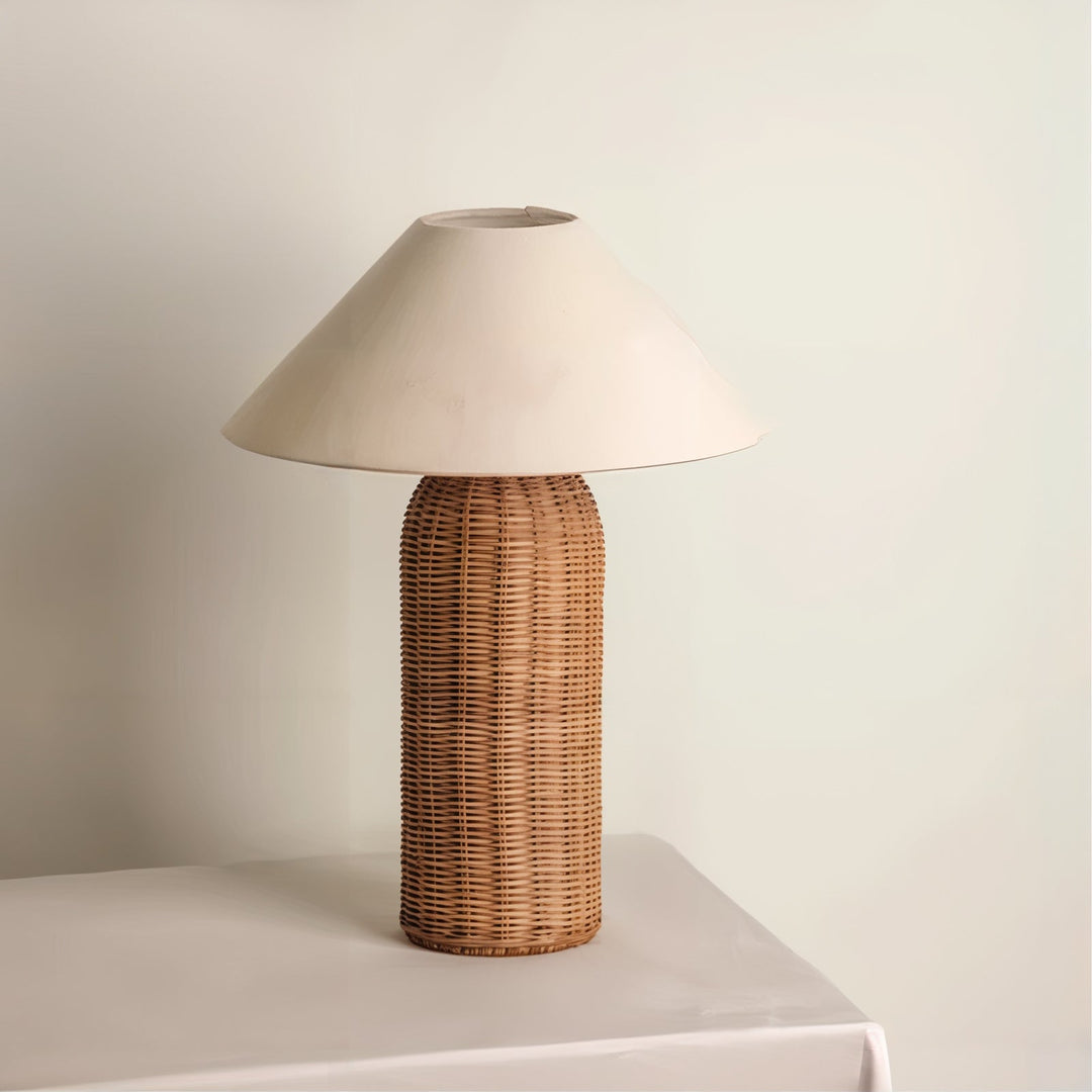 Mid Century Table Lamp - Traditional Yet Contemporary on a white table, featuring a woven rattan shade.