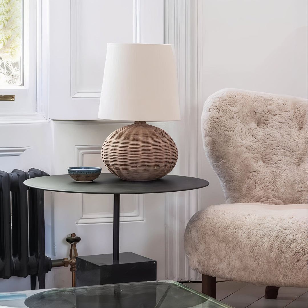 Mid Century Table Lamp - Traditional Yet Contemporary on a side table next to a cozy armchair.