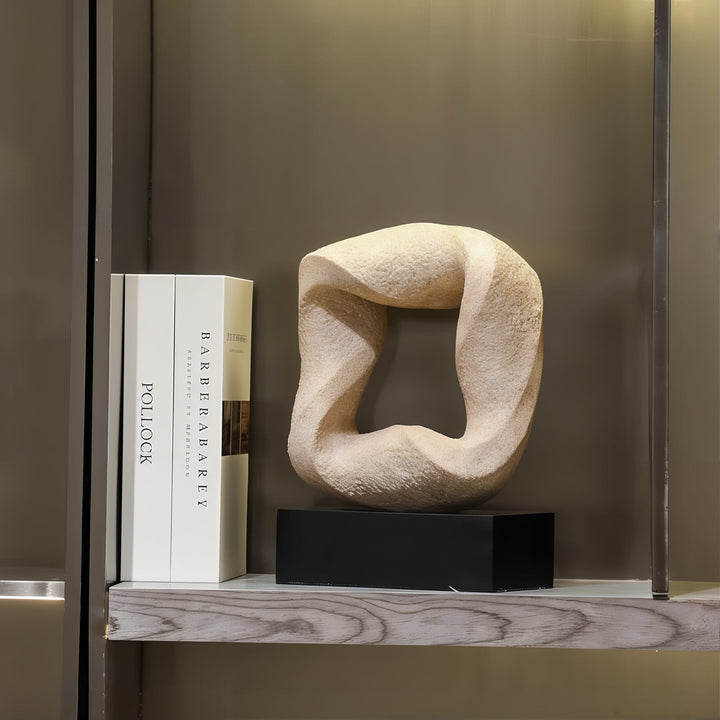 Abstract Sculpture - Ceramic Sculpture on a shelf next to books, showcasing modern abstract design and elegance.