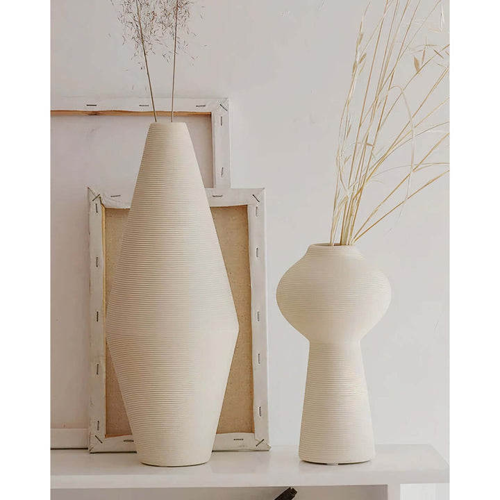 Flower Vase - White Vase displayed with dried flowers and decorative frame in a chic interior setting.