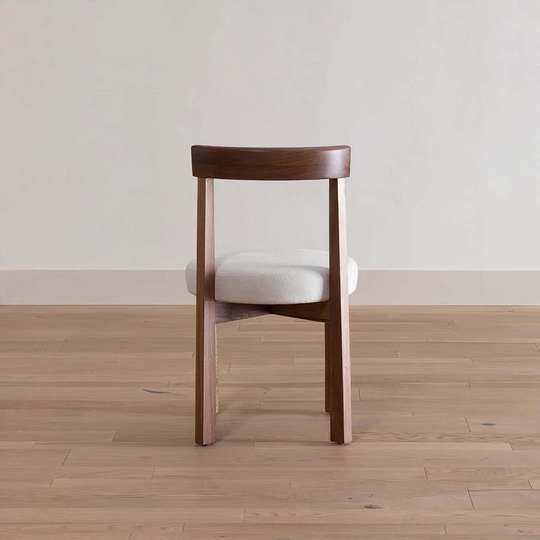 Wood Dining Chair - Natural Beauty seen from the back, featuring a solid ashwood frame and plush velvet cushion.