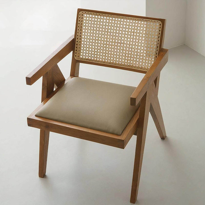 Wood Dining Chair With Cushion - Mid Century Armchair featuring a rattan back and beige leather seat.