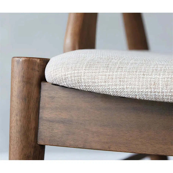 Wood Dining Chair With Cushion - For Your Dining Room close-up of cushioned seat and wooden frame.