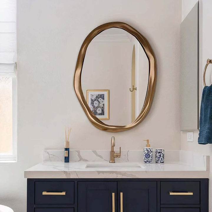 Gold Mirror - Circle Mirror in a bathroom setting above a stylish sink, showcasing its contemporary design.